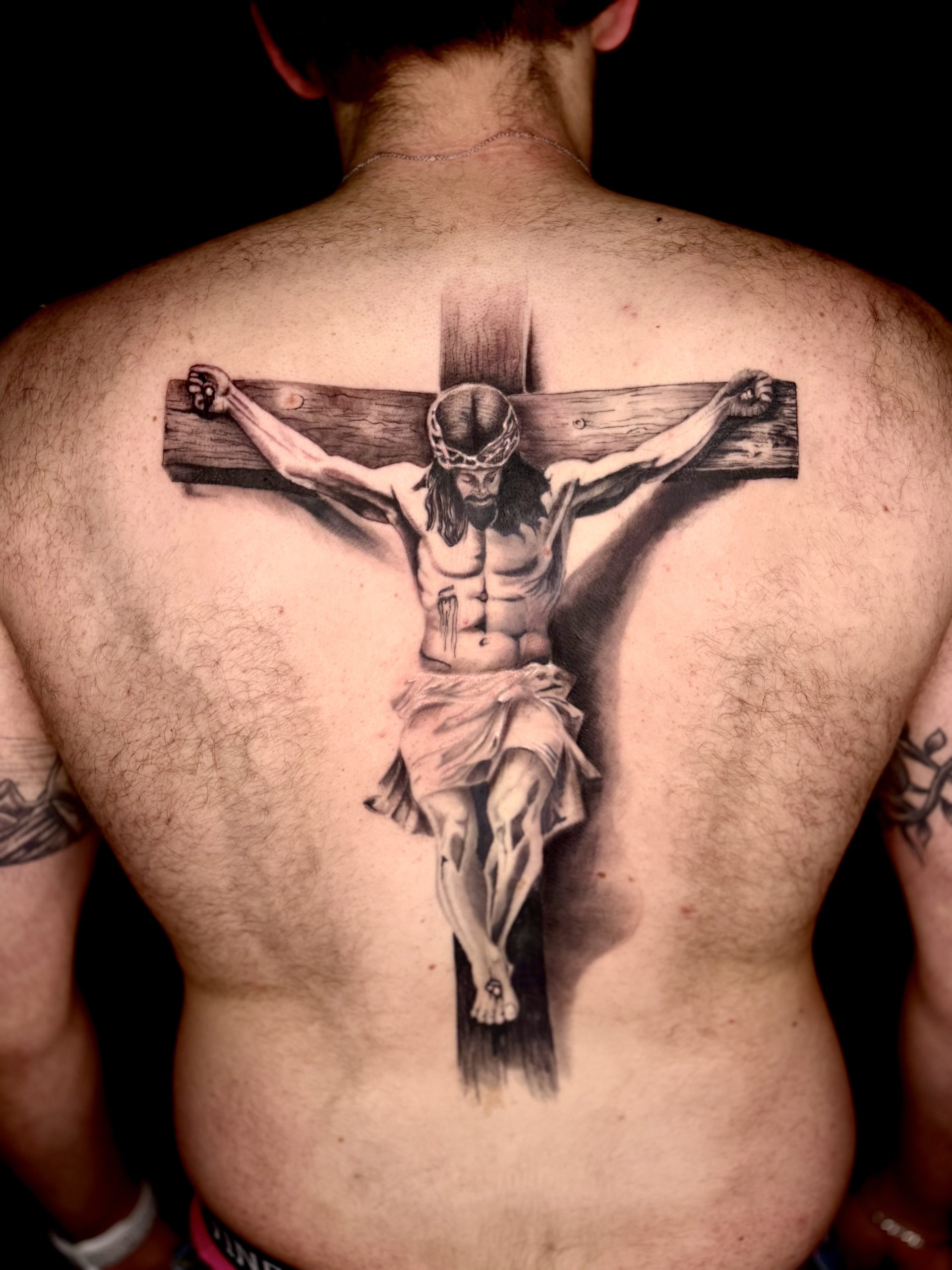 Ink23 Tattoo mit Jesus am Kreuz